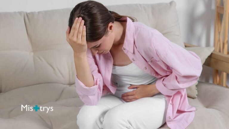 Woman holding her stomach with UTI pain
