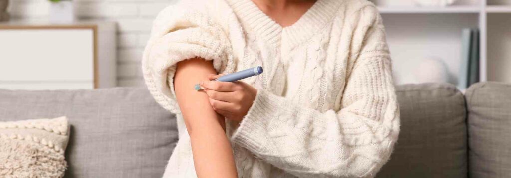 Woman injecting weight loss medication into her arm