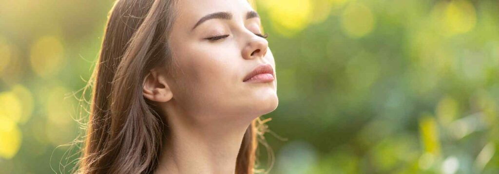 Woman outside, free of seasonal allergies