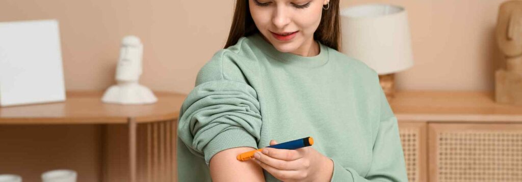 Woman using weight loss injections in the arm