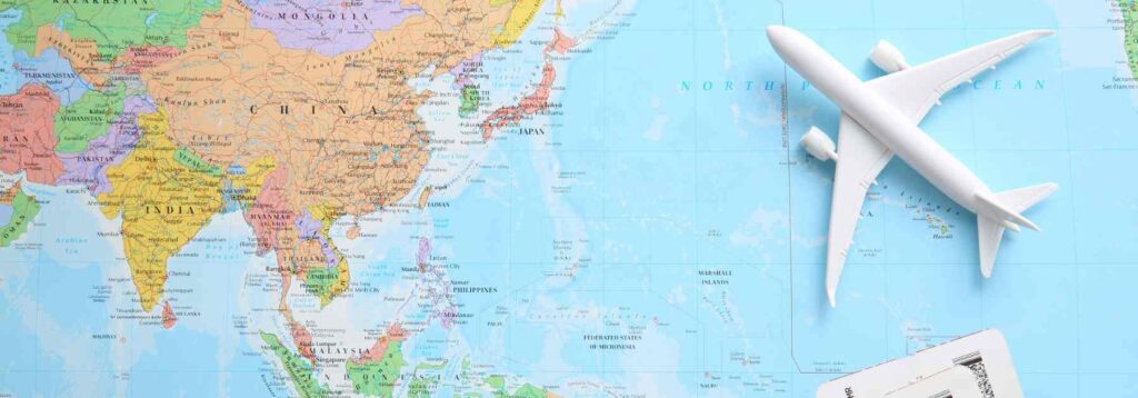 world map and model plane illustrating travel destinations